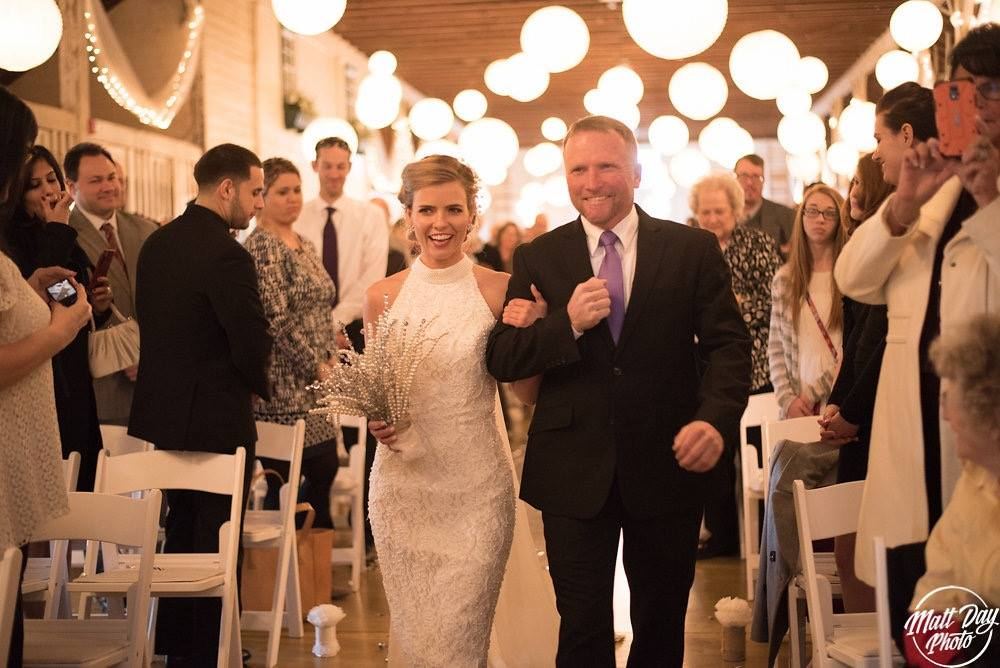 Father walking the bride down the aisle